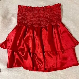 Silky red skirt.